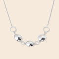 Collier chaîne fine anneaux et pastilles argenté